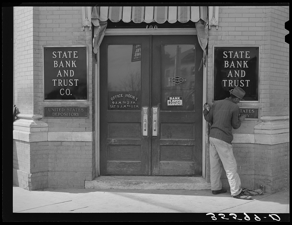 The door of a bank in San Marcos, Texas, in March 1940, photographed by Russell Lee for the Farm Security Administration.