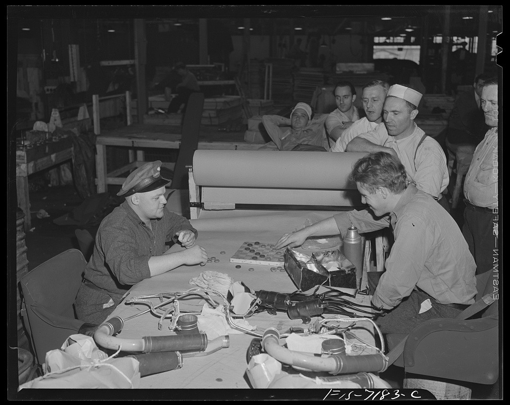 Workers at the Dodge truck plant in Detroit playing checkers during their lunch hour, photographed by Arthur Siegel in August 1942